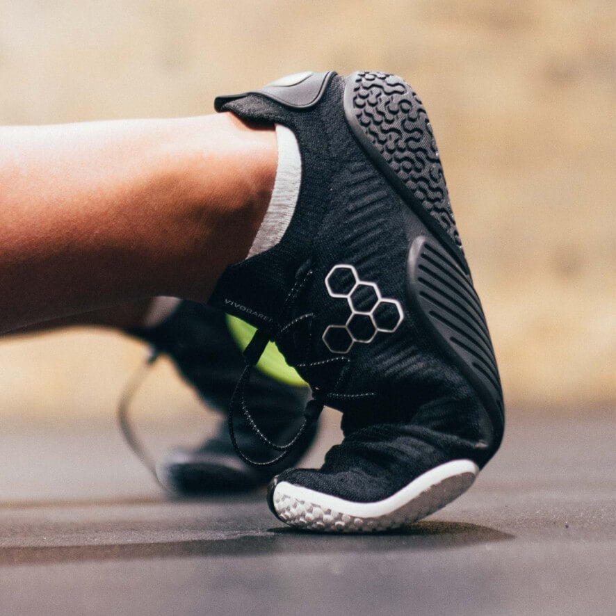 Official Vivobarefoot Motus Flex training lifestyle; model imagery